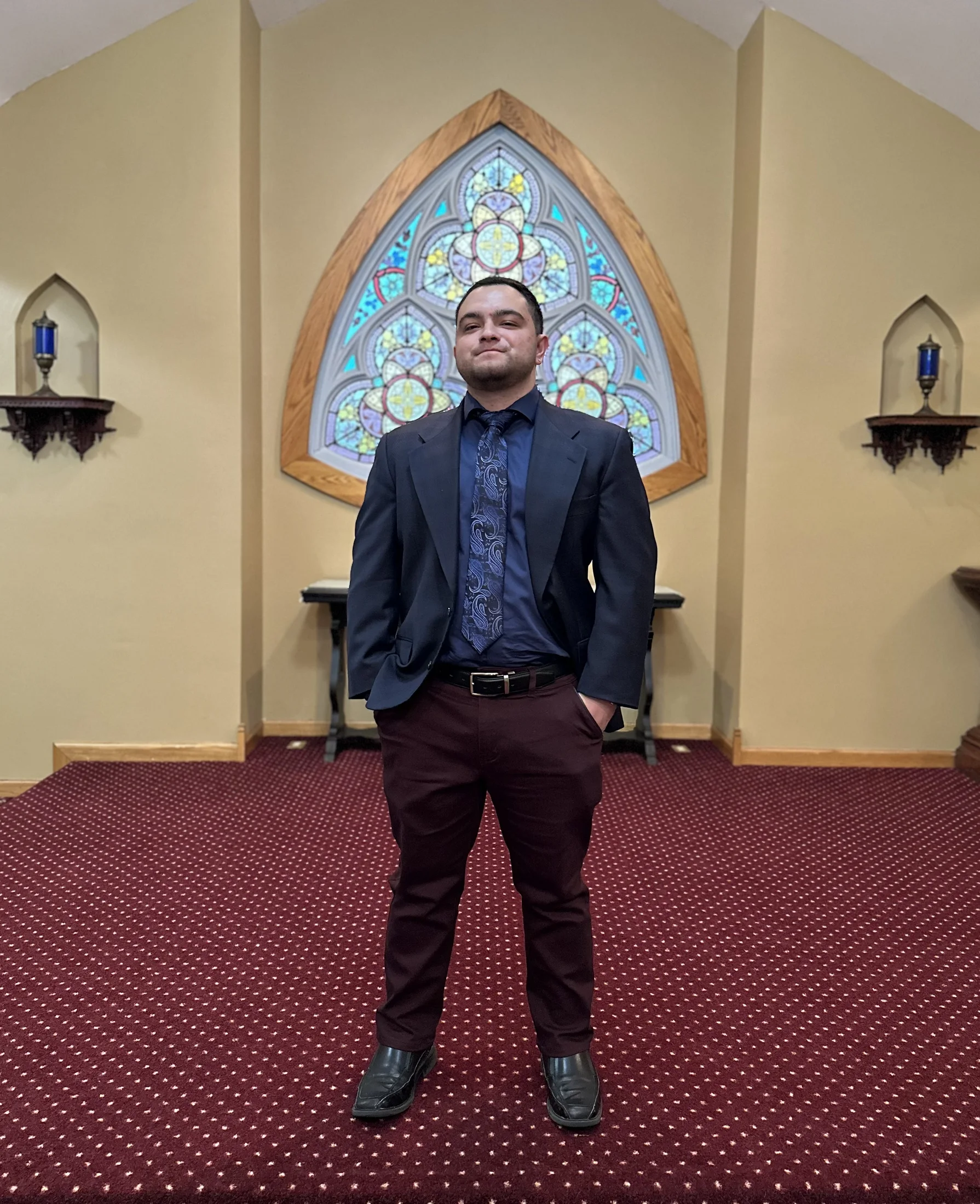 Donald Wilkin in a suit inside an architectural interior