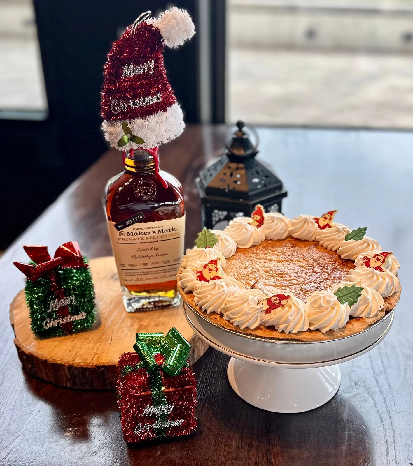 Brand photography of alternate branded whiskey, lantern and pie arrangement