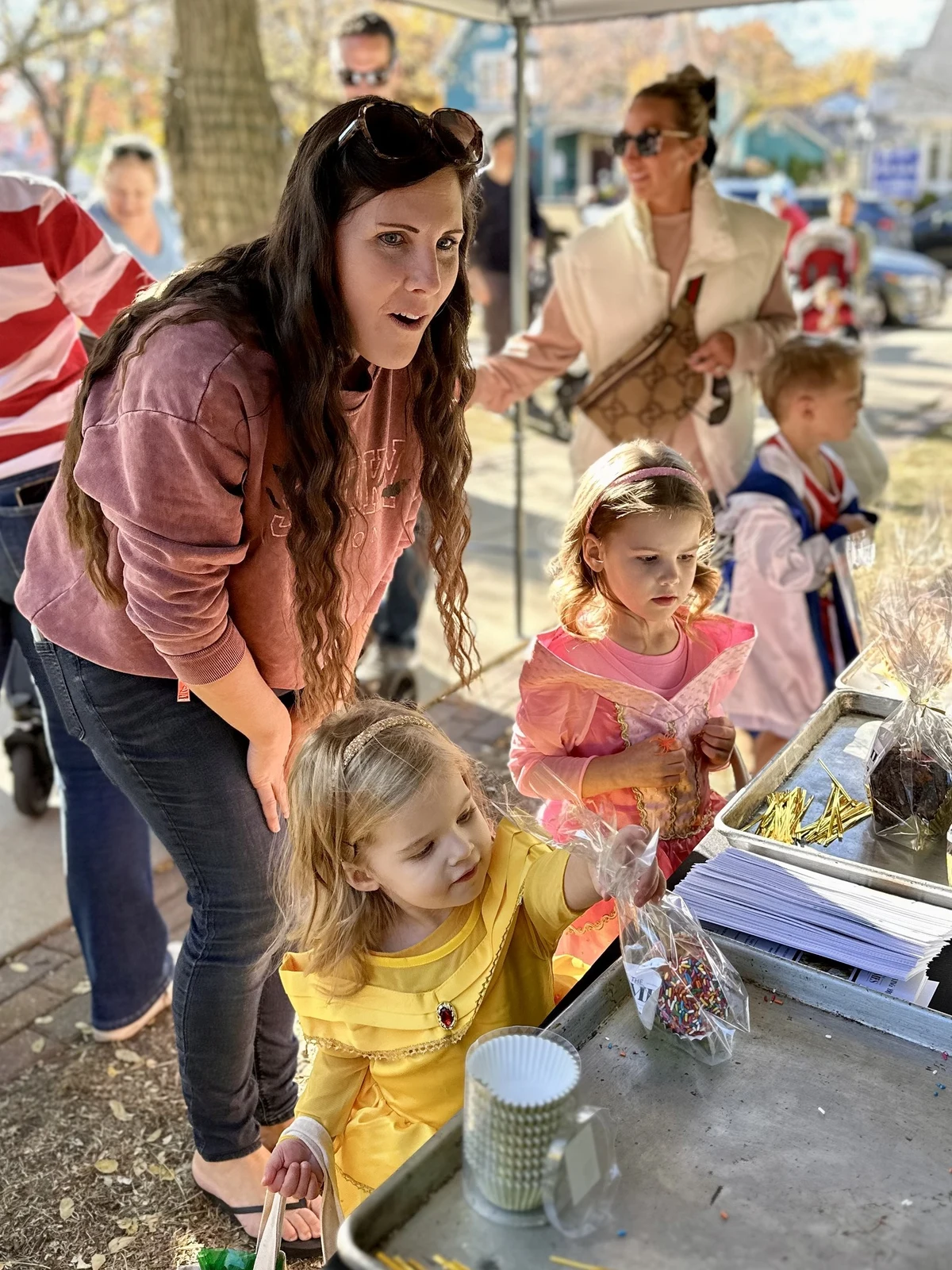 Hospitality event photography of families and children interacting at outdoor community event